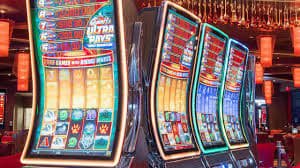 Tampilan aplikasi Vegas Group Download di smartphone Android menunjukkan halaman utama lengkap dengan navigasi